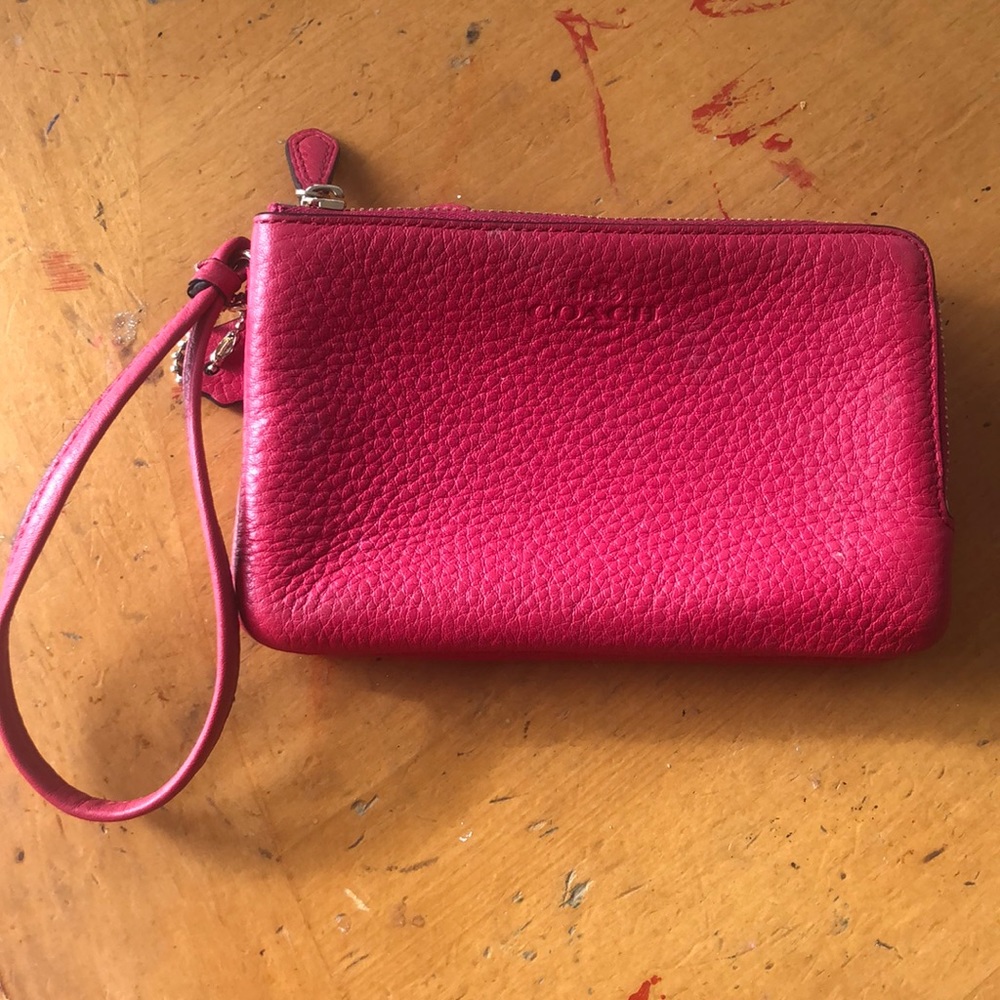 Bright pink Coach wristlet